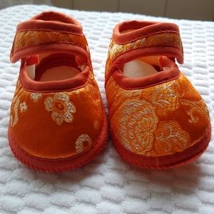 Orange baby shoes